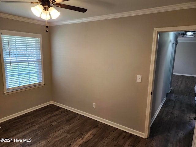 spare room featuring ceiling fan, ornamental molding, and dark hardwood / wood-style floors