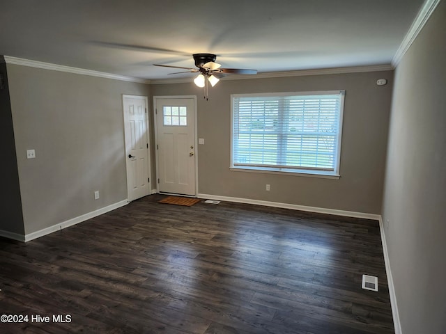 entryway with dark hardwood / wood-style flooring, crown molding, and ceiling fan