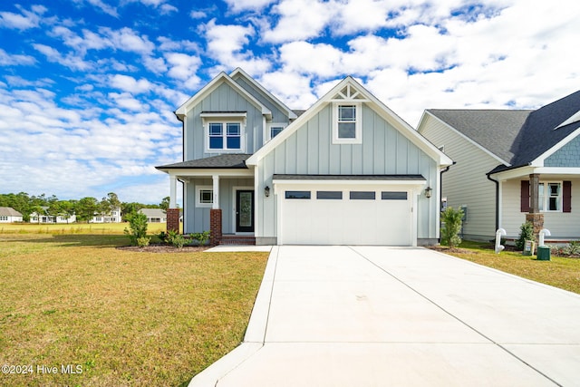 craftsman house with a garage, a front yard, and a porch