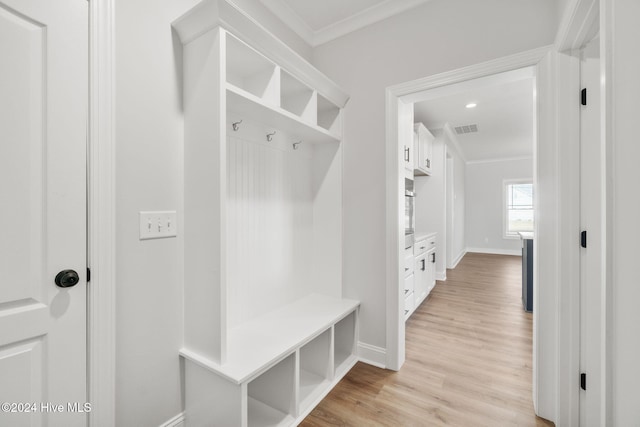 mudroom featuring ornamental molding and light hardwood / wood-style floors