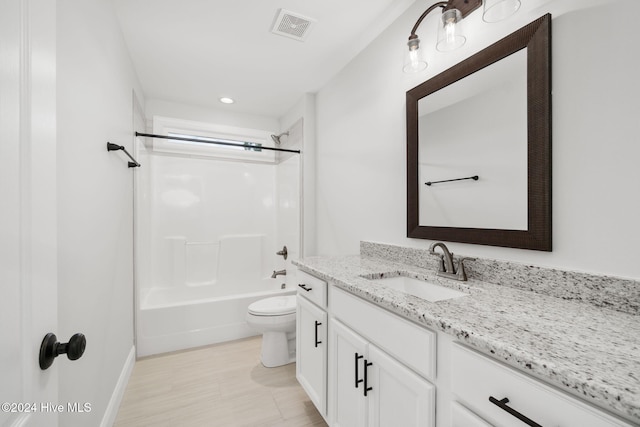 full bathroom with toilet, vanity, and  shower combination