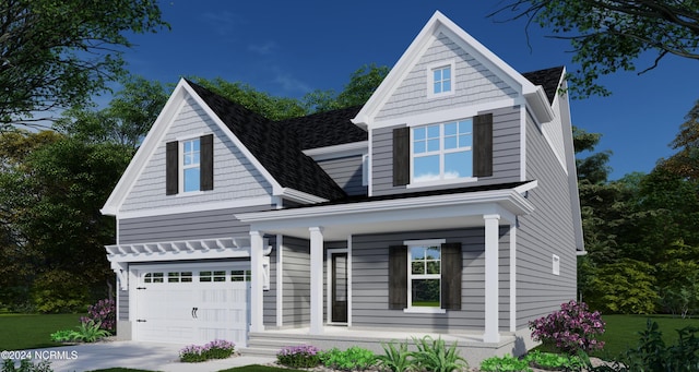 view of front of property featuring covered porch and a garage