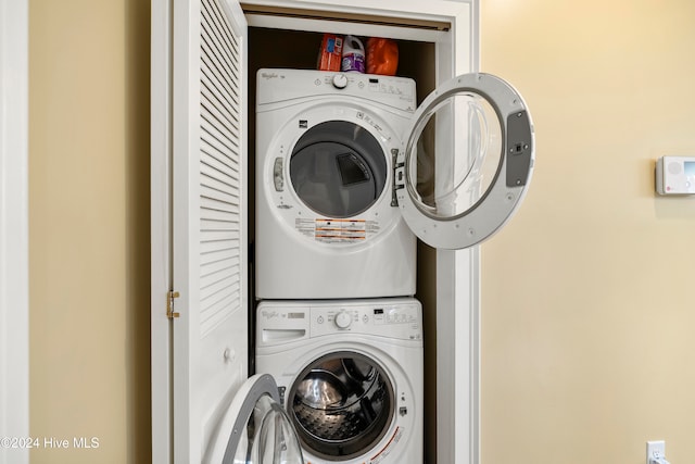 washroom with stacked washer and clothes dryer