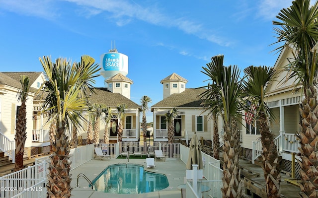 view of swimming pool with a patio