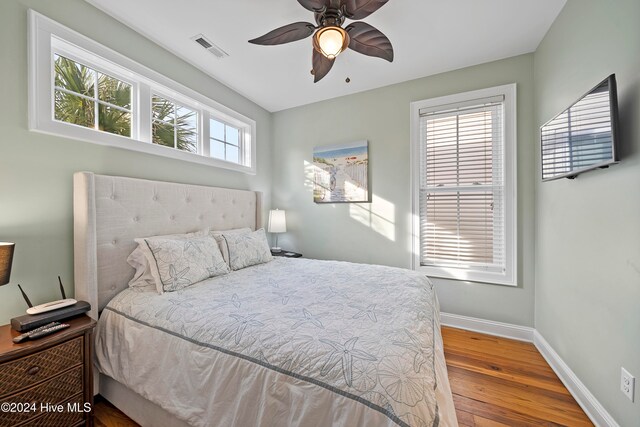 bedroom featuring hardwood / wood-style flooring and ceiling fan