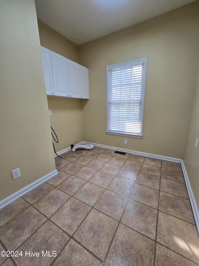 washroom featuring light tile patterned flooring