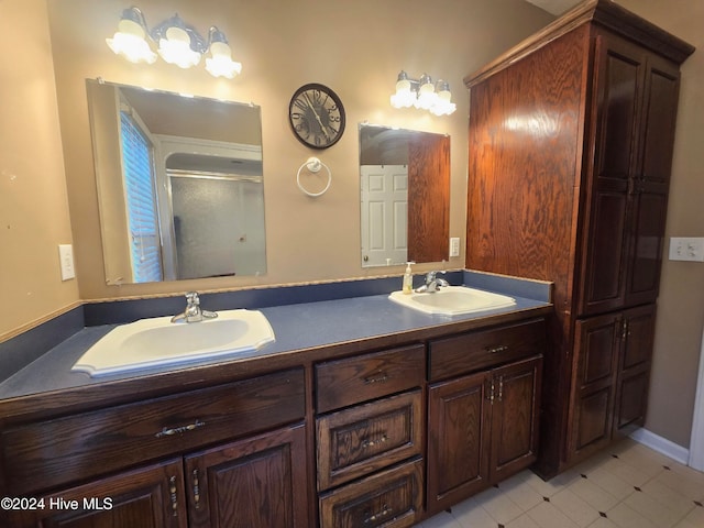 bathroom with vanity, tile patterned flooring, and walk in shower