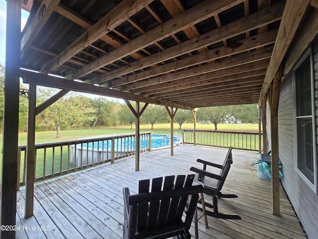 wooden terrace with a yard