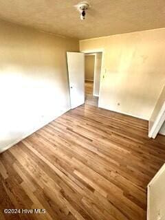 empty room featuring hardwood / wood-style flooring