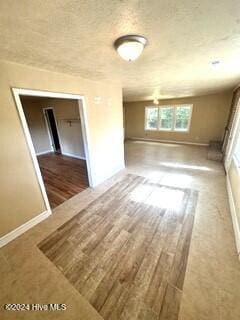 empty room with hardwood / wood-style floors