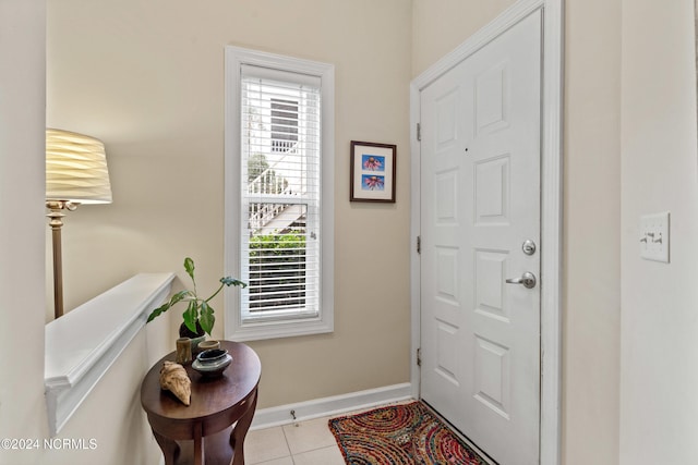 foyer with light tile patterned floors