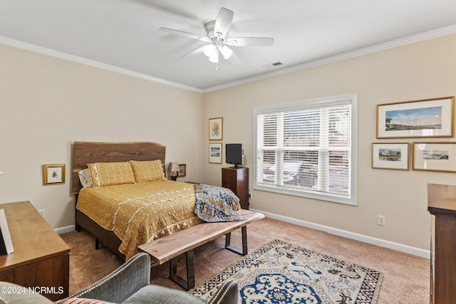 carpeted bedroom featuring crown molding and ceiling fan