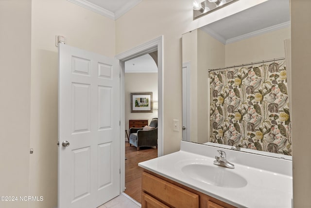 bathroom with crown molding, tile patterned floors, a shower with shower curtain, and vanity