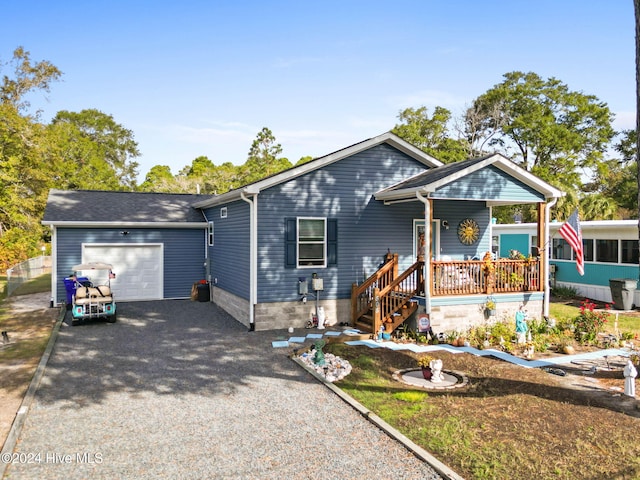 view of front of house featuring a porch and a garage