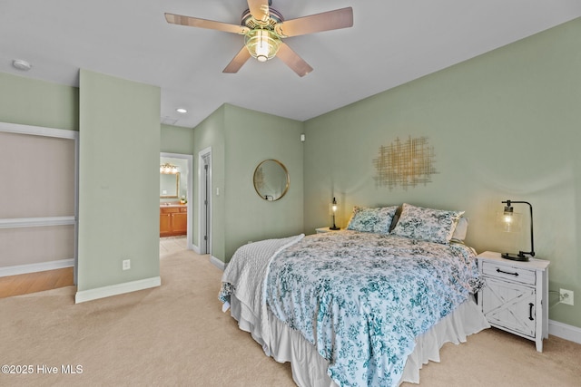 carpeted bedroom featuring ensuite bathroom and ceiling fan