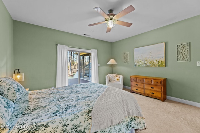 carpeted bedroom with ceiling fan and access to exterior