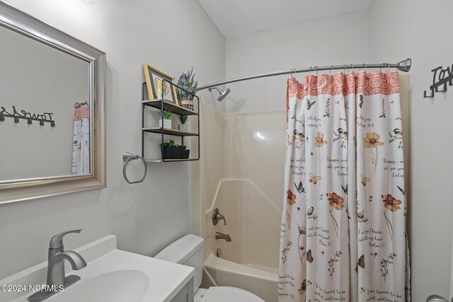 bedroom with light colored carpet, vaulted ceiling, and baseboards