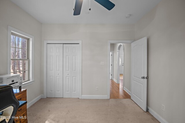 bathroom with toilet, shower / bath combo with shower curtain, and vanity