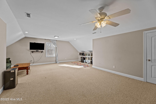 additional living space with ceiling fan, carpet floors, and vaulted ceiling