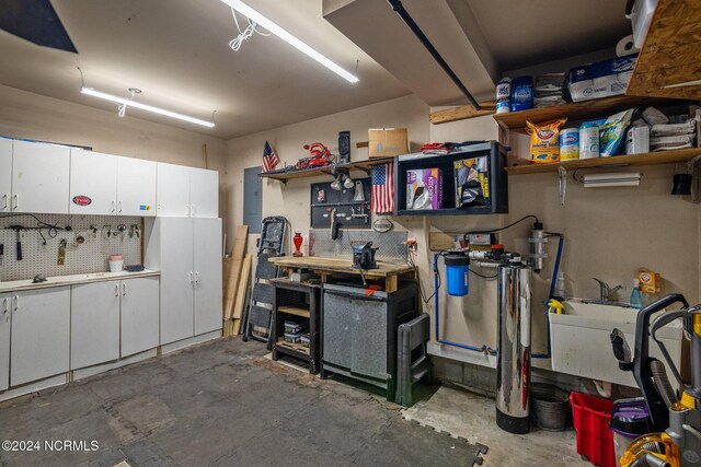 garage with freestanding refrigerator and a garage door opener