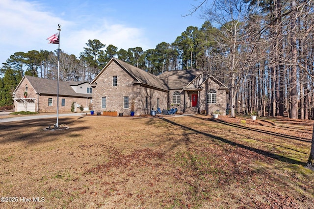 view of front facade with a front yard and a garage