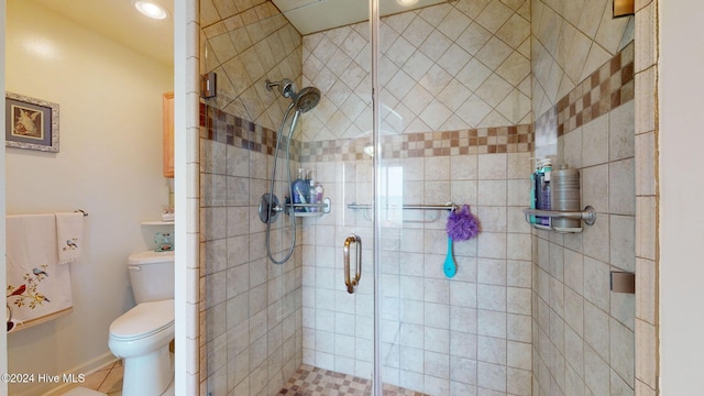 bathroom featuring an enclosed shower, toilet, and tile patterned floors