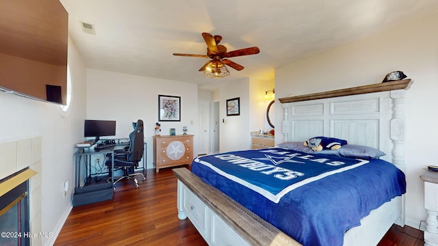 bedroom with ceiling fan and dark wood-type flooring