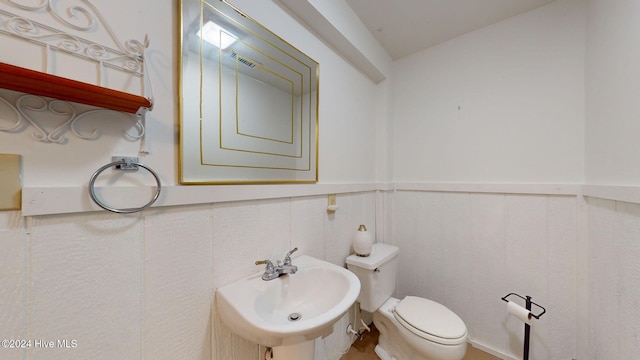 bathroom with toilet and sink