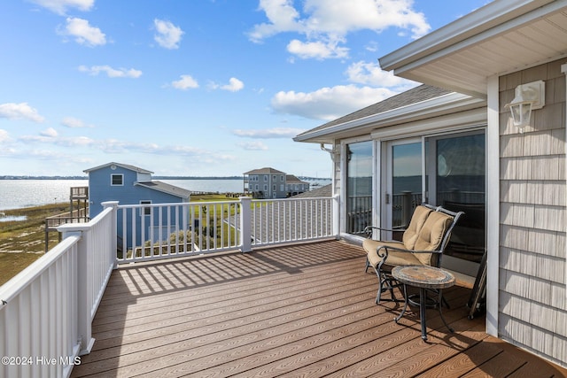 wooden terrace with a water view