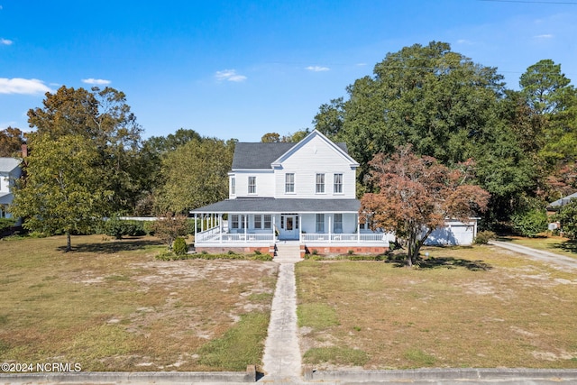 farmhouse with a porch and a front lawn