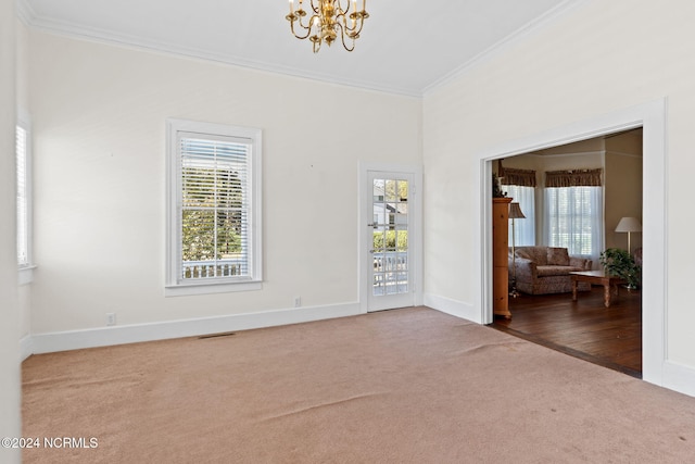 950 Main St, Fair Bluff, NC 28439 - carpeted empty room featuring crown molding, a chandelier, healthy amount of natural light, and baseboards