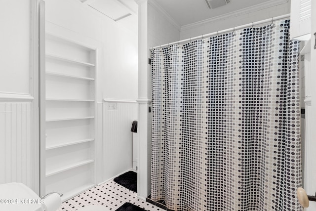 950 Main St, Fair Bluff, NC 28439 - full bath with built in shelves, ornamental molding, wainscoting, a shower with shower curtain, and a decorative wall