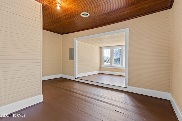 950 Main St, Fair Bluff, NC 28439 - unfurnished room featuring wooden ceiling, baseboards, and dark wood-style flooring