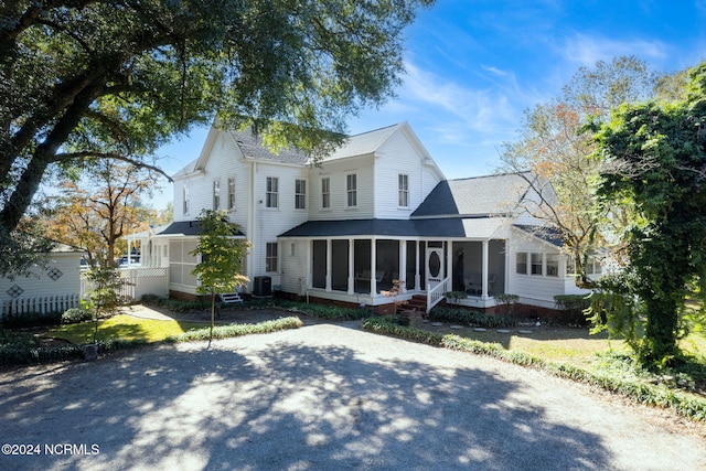 950 Main St, Fair Bluff, NC 28439 - farmhouse inspired home featuring a sunroom, roof with shingles, fence, and central AC