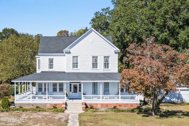 950 Main St, Fair Bluff, NC 28439 - farmhouse inspired home with a porch, a shingled roof, and a front yard