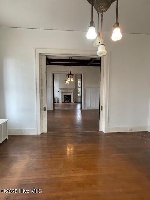 4290 W Church St, Farmville, NC 27828 - unfurnished dining area featuring baseboards, wood finished floors, and a fireplace