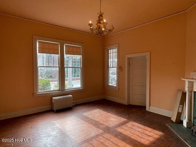 4290 W Church St, Farmville, NC 27828 - unfurnished dining area featuring baseboards, an inviting chandelier, a wealth of natural light, and radiator