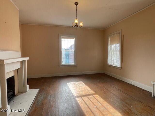 4290 W Church St, Farmville, NC 27828 - unfurnished living room with crown molding, baseboards, a chandelier, and hardwood / wood-style flooring