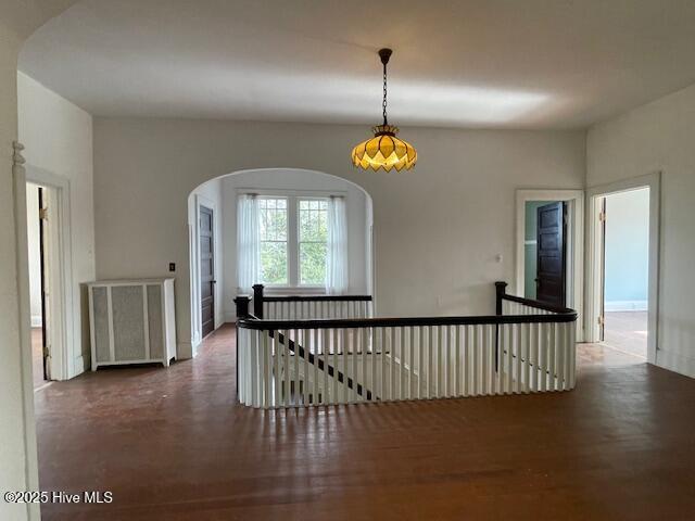 4290 W Church St, Farmville, NC 27828 - corridor featuring arched walkways and an upstairs landing