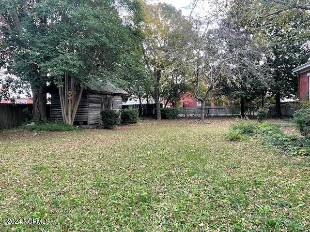 4290 W Church St, Farmville, NC 27828 - view of yard with fence and an outbuilding