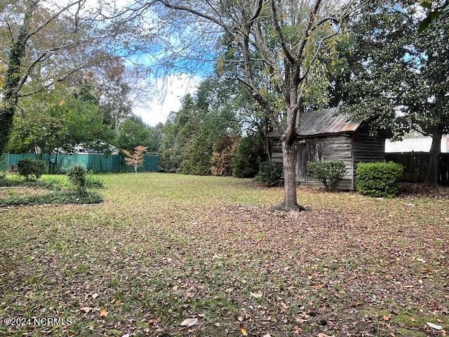 4290 W Church St, Farmville, NC 27828 - view of yard featuring fence and an outbuilding