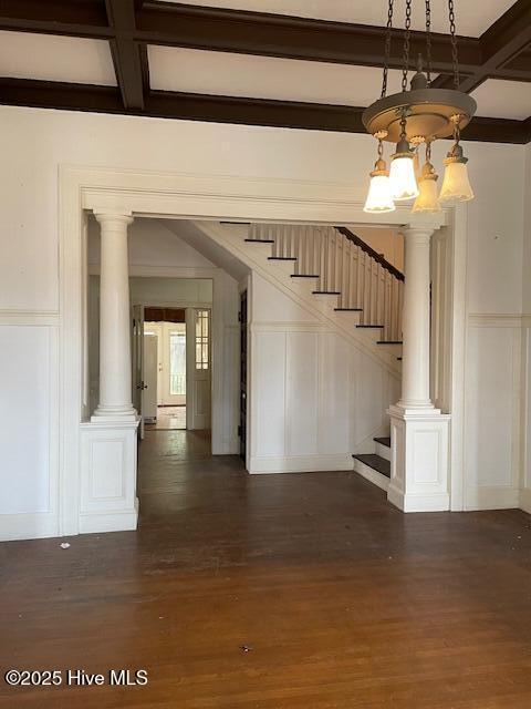 4290 W Church St, Farmville, NC 27828 - unfurnished living room featuring wood finished floors, a decorative wall, beam ceiling, stairway, and coffered ceiling