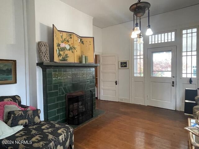 entrance foyer with a fireplace and dark hardwood / wood-style floors