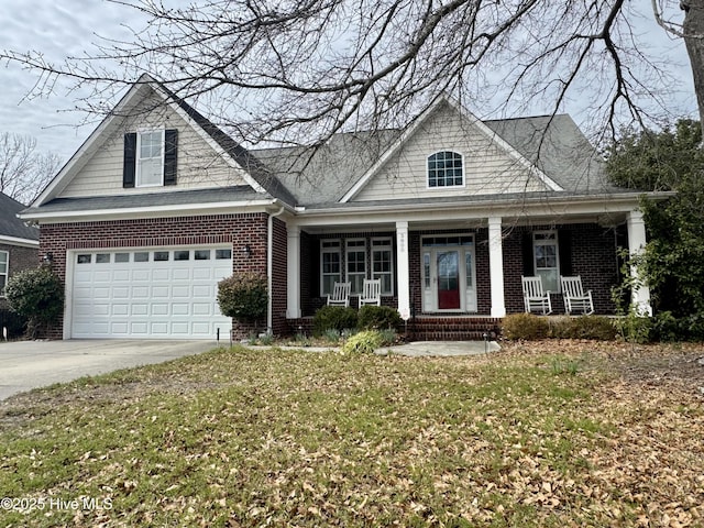 view of front facade with brick siding, covered porch, concrete driveway, and an attached garage