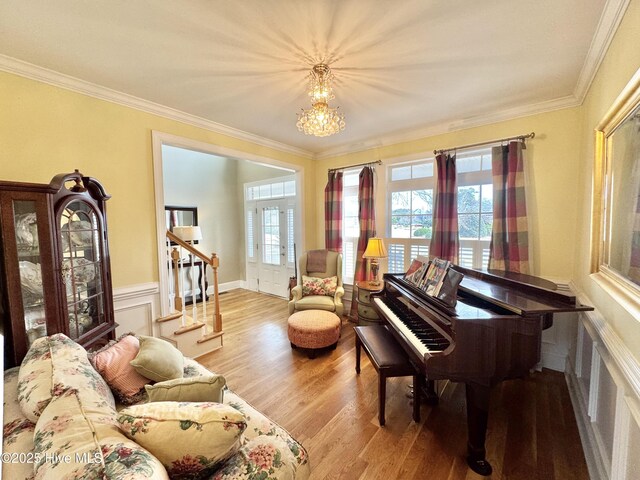 5800 Neelys Ct, Wilmington, NC 28409 - sitting room with stairs, ornamental molding, wood finished floors, a chandelier, and wainscoting
