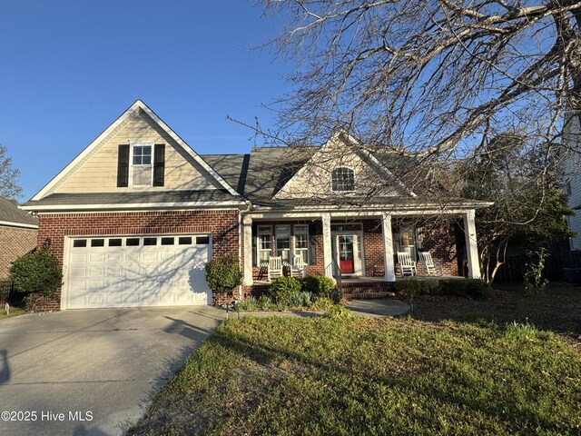 5800 Neelys Ct, Wilmington, NC 28409 - view of front facade with concrete driveway, a porch, and brick siding