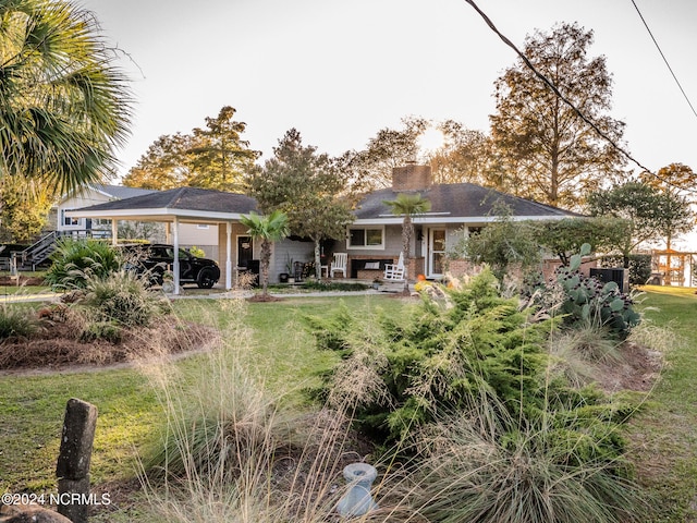 back of house with a yard