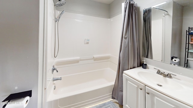 bathroom featuring vanity and shower / bathtub combination with curtain