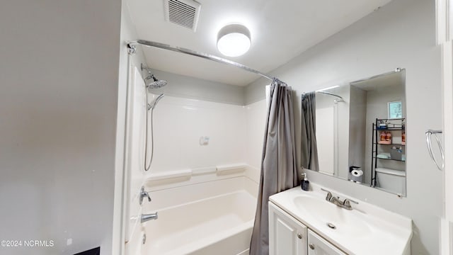 bathroom with vanity and shower / bath combo with shower curtain