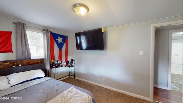 bedroom featuring hardwood / wood-style floors